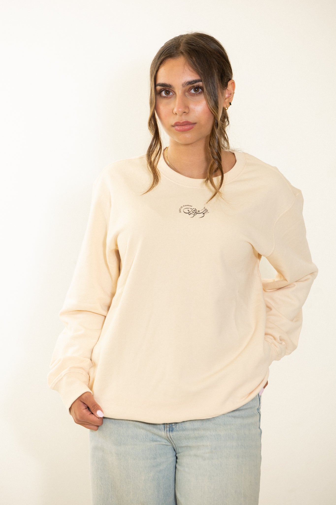 Arabic Heritage beige sweatshirt with a graphic Cairo Nights Umm Kulthum design on the back.