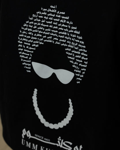 Black Umm Kulthum hoodie with Arabic calligraphy text, sunglasses and pearl necklace design inspired by the iconic Egyptian singer.