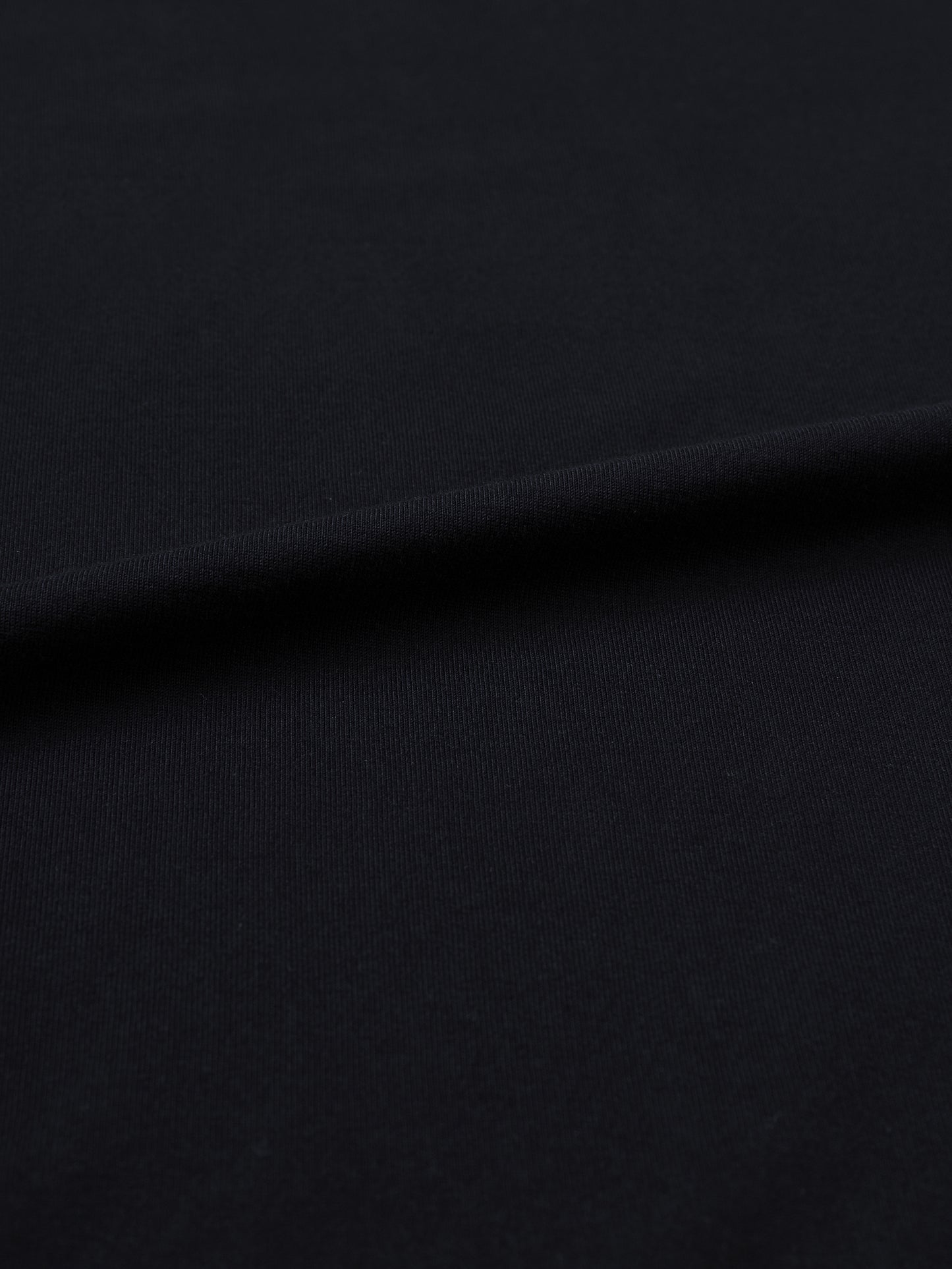 Fairuz T-shirt fit detail showing the oversized unisex cut and heavyweight 250 GSM cotton fabric.