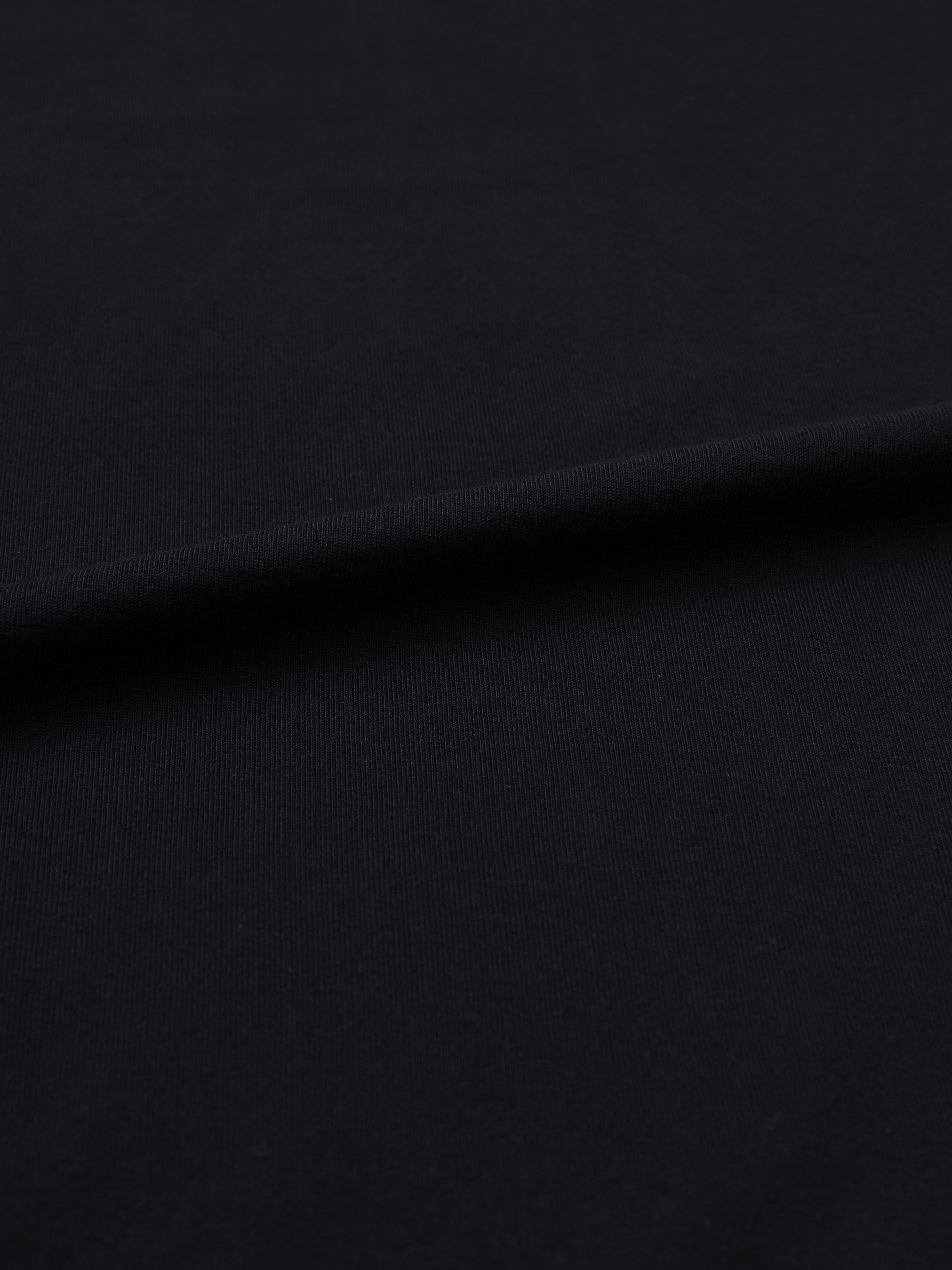 Fairuz T-shirt fit detail showing the oversized unisex cut and heavyweight 250 GSM cotton fabric.