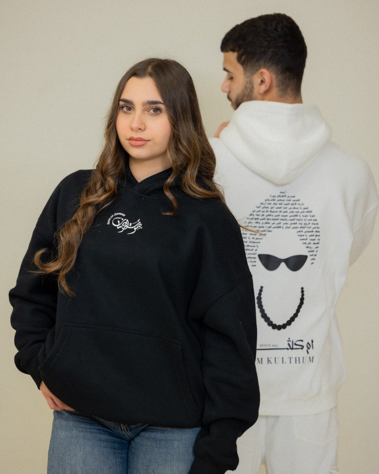Black and white Umm Kulthum El Sett oversized hoodies displayed together as Arabic heritage streetwear.