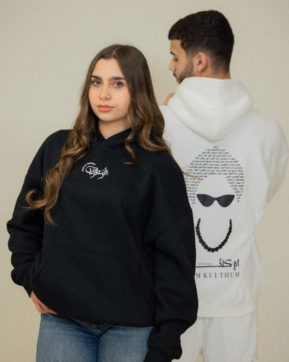 Black and white Umm Kulthum El Sett oversized hoodies displayed together as Arabic heritage streetwear.