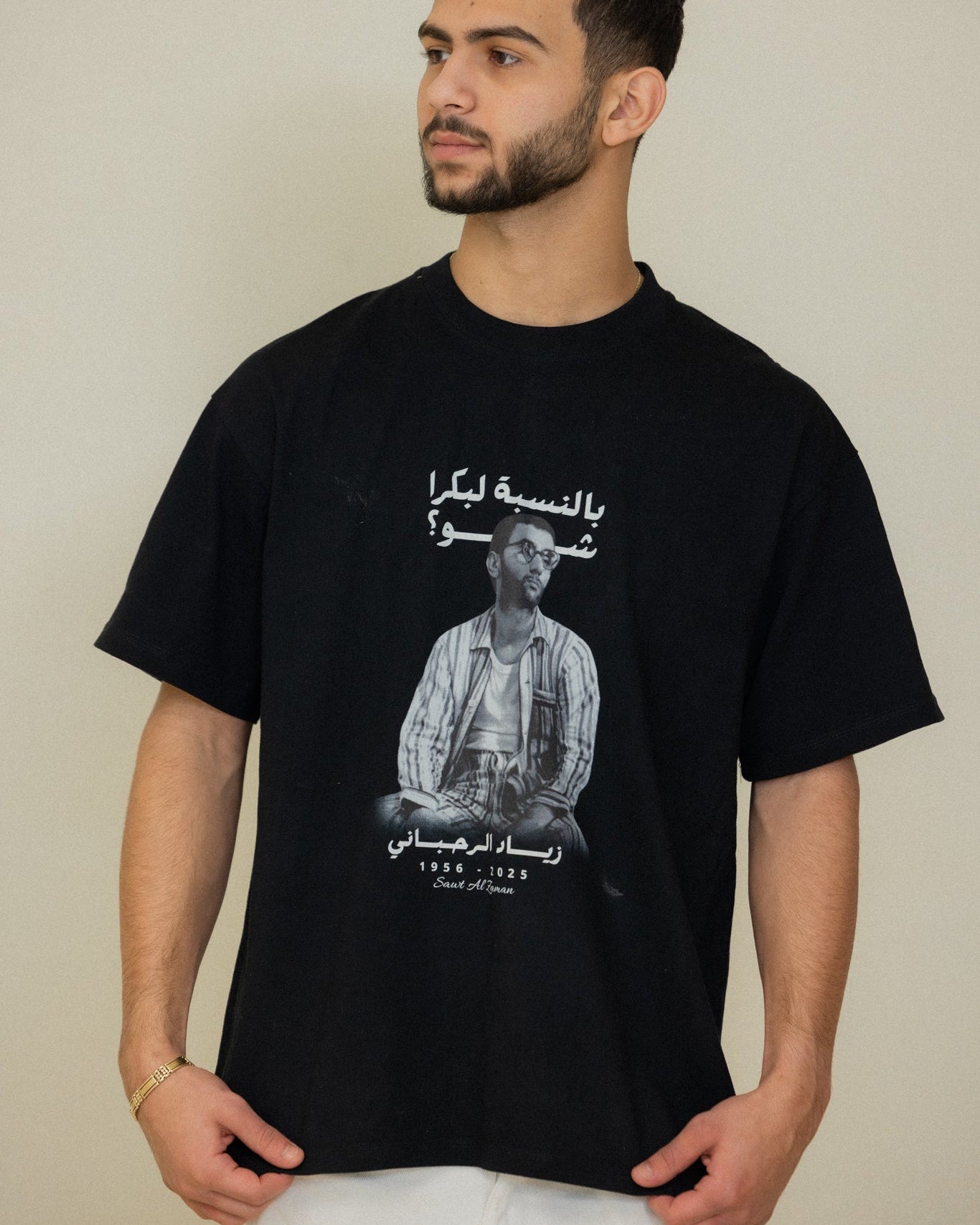 Model wearing the Ziad Al-Rahbani tribute T-shirt with Arabic typography and Lebanese music heritage artwork.